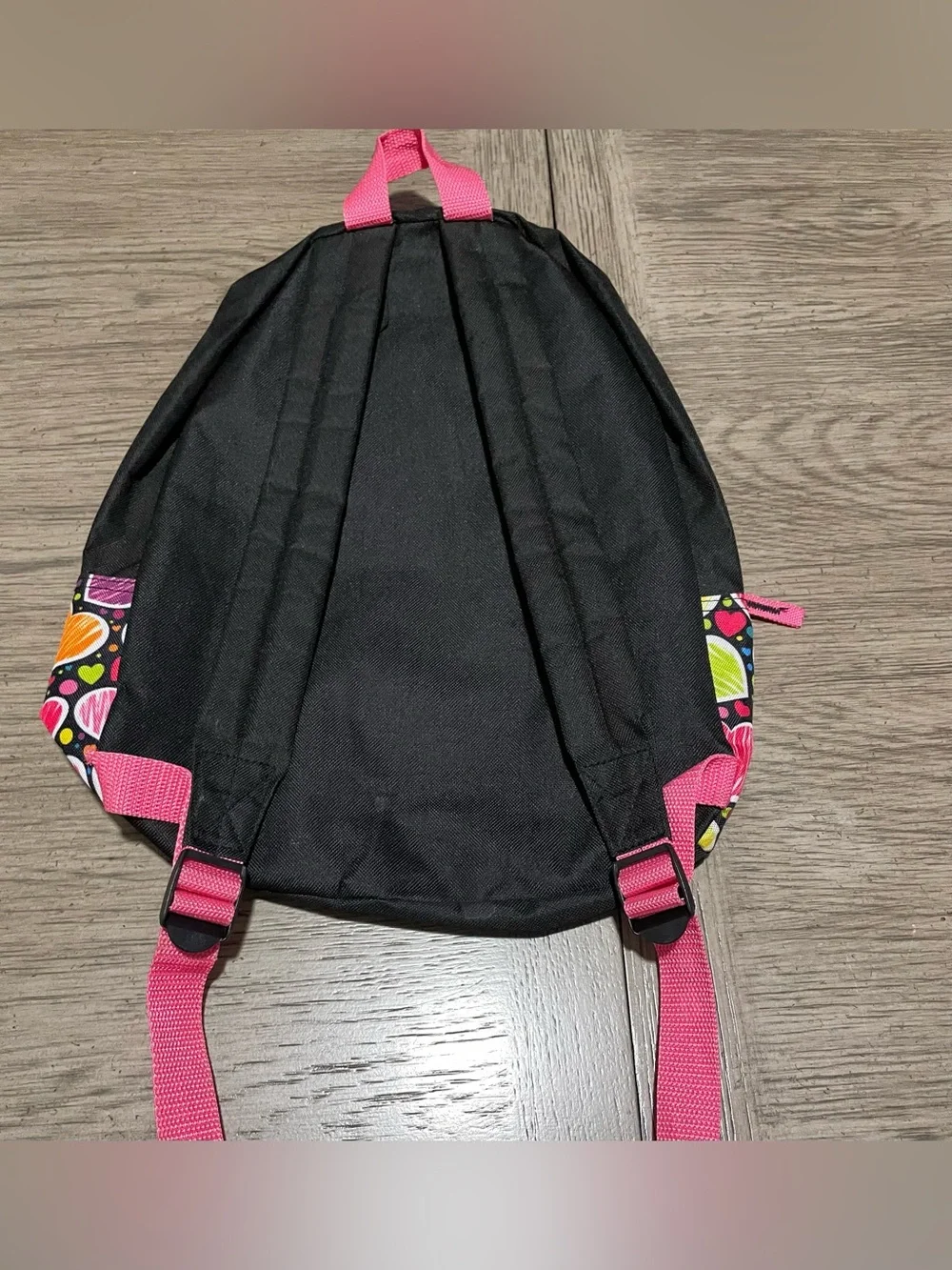 Small backpack, black with multicolored hearts